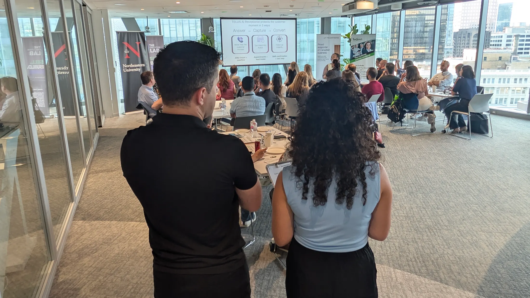 A full room at an Execution Lab event in downtown Vancouver, watching a talk